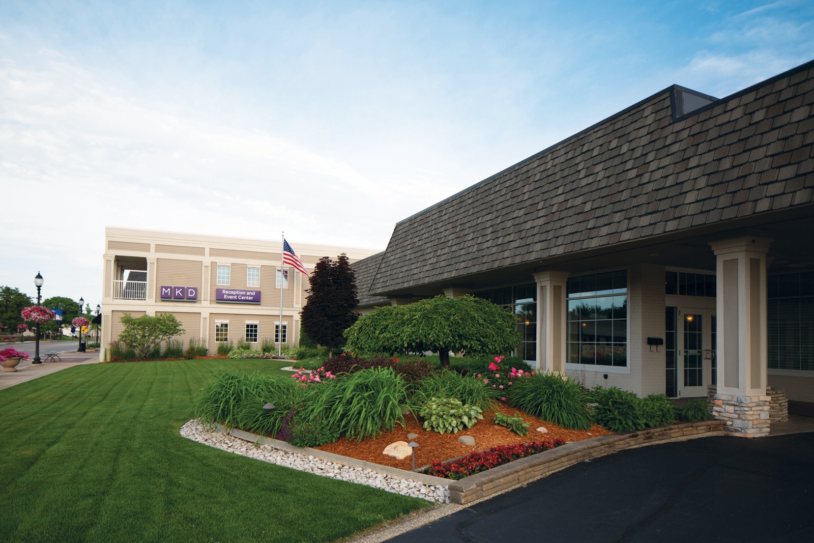 Event center with landscaped garden and flagpole