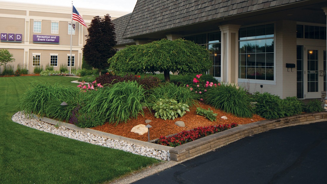 Event center with landscaped garden and American flag