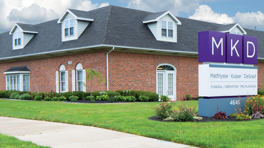 Funeral home with MKD sign outside.